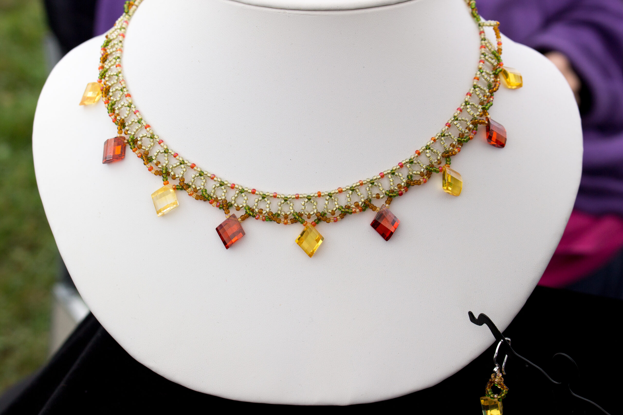 Beaded choker necklace in burnt orange and yellow, handmade by Creations With Color (Christina Miteff).